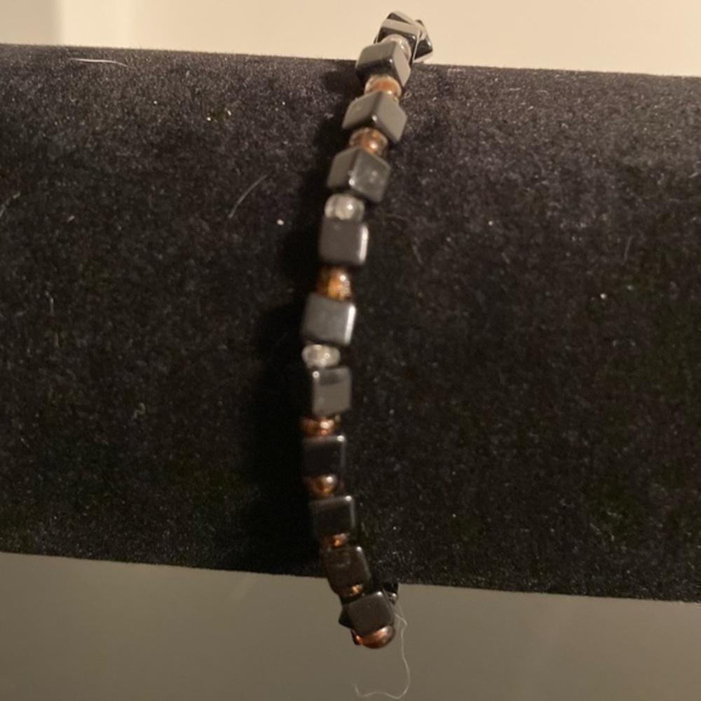 Black and amber colored beaded bracelet